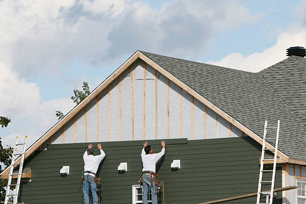 Professional Siding Installation technician working in Crystal Beach, FL